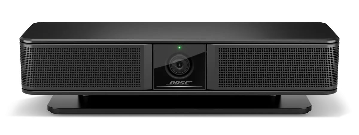 Bose Videobar VB-S kèm chân đế và remote trong hộp Bose Videobar VB-S đặt trên chân đế bàn kèm điều khiển từ xa